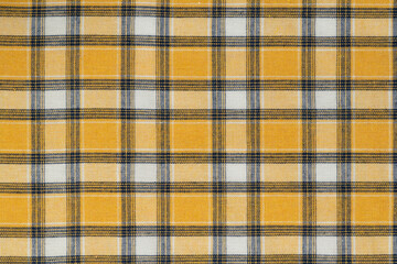 Yellow white tartan texture background. shirt fabric with a checkered pattern. factory material