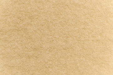 Close up of yellow carpet. Top view of texture of white foot scraper. background.