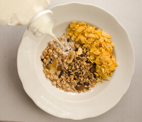 corn and oatmeal with dried fruit and milk