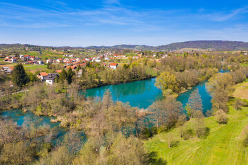 Fototapeta premium Mreznica river in Croatia from air, drone view of Belavici village in spring