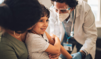 Child receiving covid vaccine at home