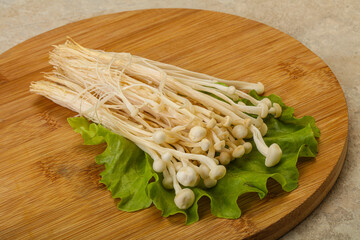 Raw Enoki mushrooms for cooking