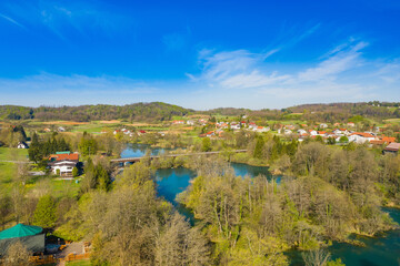 Beautiful countryside landscape, Mreznica river from air, aerial view of Belavici village in Croatia