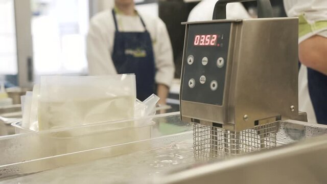 Boiling water in the machine for sous vide cooking. Close up