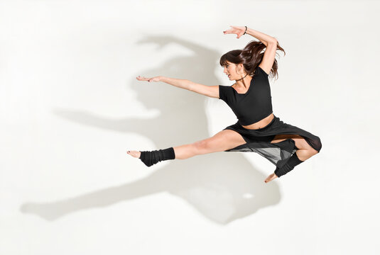 Agile young woman dancer performing a front half split jump - Powered by Adobe