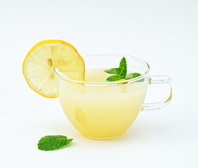 Lemon juice, lemon slice and mint, stylish drink, white background