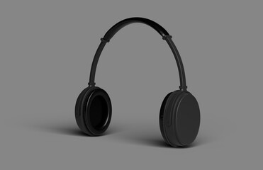 Fototapeta na wymiar Black wireless headphones over grey background