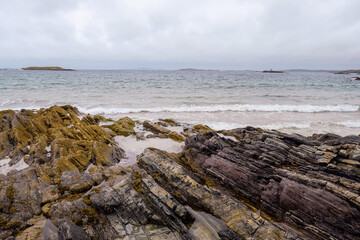 Fototapeta na wymiar Rough coarse stone coastline and powerful ocean wave. West coast of Ireland. Irish nature landscape. Connemara area.