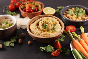 hummus,  pita bread and olives