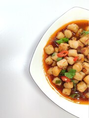 Stir-fried scallops with red pepper, green onion and celery leaves, seafood delicacy, top view