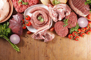 variety of raw meats- beef,  sausage, steak,  roast beef