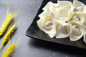 The spare wonton in a black plate, traditional Chinese food