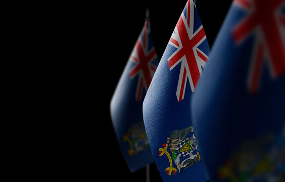 Small National Flags Of The South Georgia And The South Sandwich Islands On A Black Background