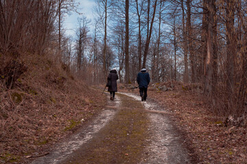 Couple walking on the path on the mountain forest
