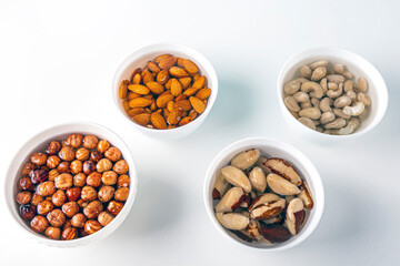 Process of soaking various nuts: almonds, hazelnuts, cashew, brazilian nut in water to activate. Home Cooking: making plant based organic veggie Milk, lactose free