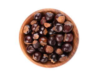 Guarana seed in wooden bowl, isolated on white background. Dietary supplement guarana, caffeine cource for energy drinks. Top view.