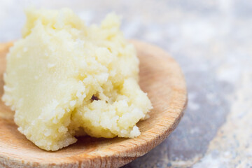 Shea butter on light background, unrefined, close up