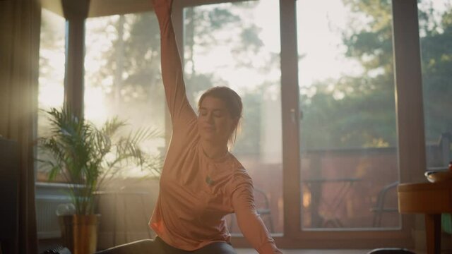 Beautiful Girl Doing Fitness Exercises at Home. Authentic Gorgeous Plus Size Woman Doing Workout, Hamstring Stretching, Yoga. Healthy Fit Confident Female Doing Sport Routine on a Sunny Day