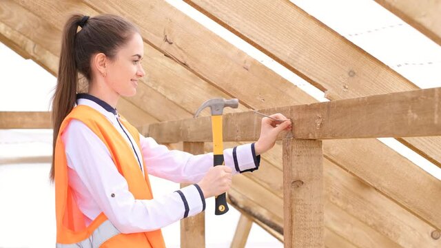 Gender stereotype woman working on construction site.