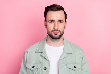 Photo of nice optimistic brunet man wear grey shirt isolated on pastel pink color background