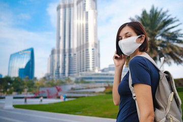 Young beautiful woman enjoying the view of Dubai downtown.