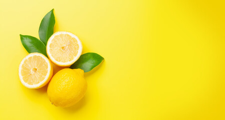 Fresh ripe lemon on yellow background