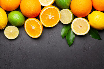 Fresh ripe citrus fruits on stone background