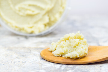 Shea butter on light background, unrefined, close up