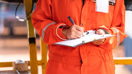 Action of safety officer is wirtinng and check on checklist document during safety audit and...