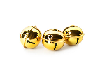 Shiny golden sleigh bells on white background