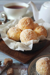 Coconut flakes cookies and cup of tea