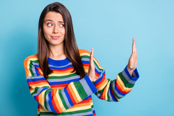 Portrait of attractive brown-haired girl showing ban sign aside refuse bad news isolated over...