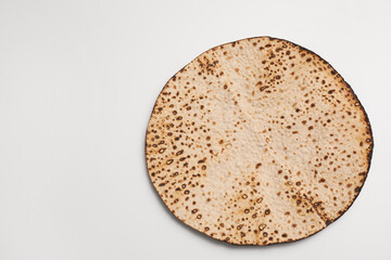 Tasty matzo isolated on white, top view. Passover (Pesach) celebration