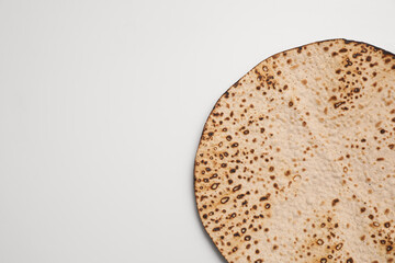 Tasty matzo isolated on white, top view. Passover (Pesach) celebration