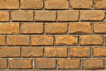 Texture of brick wall. Samples of wall or fence are presented at exhibitions. Orange brick close up.