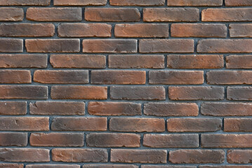 Texture of brick wall. Samples of wall or fence are presented at exhibitions. Purple brick close up.