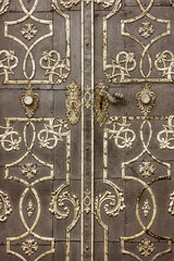 old historical metal decorated door from the church