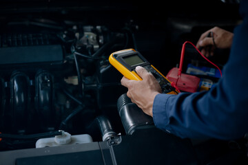 Car service, repair, maintenance concept. Auto mechanic working in garage.