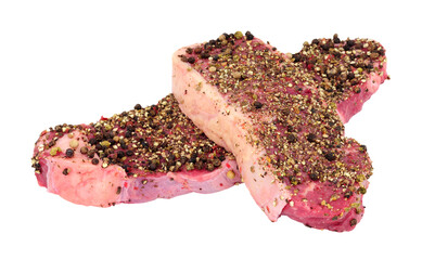 Two peppercorn covered raw sirloin steaks isolated on a white background