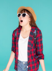 Fototapeta premium Beautiful young asian woman shouting sound loud with mouth for announce something in vacation travel with excited isolated on blue background, tourist asia girl journey in summer concept.