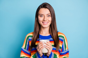 Photo of young attractive girl happy positive smile enjoy morning cup of coffee isolated over blue color background