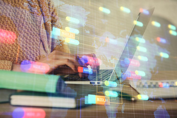 Double exposure of woman hands working on computer and data theme hologram drawing. Tech concept.