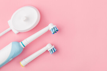 Electric toothbrush set. Modern rechargeable sonic or electric toothbrush set with charger and...