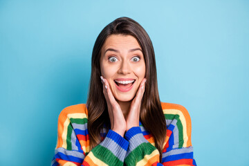Fototapeta premium Photo portrait of shocked woman touching cheeks opened mouth staring isolated on bright blue color background