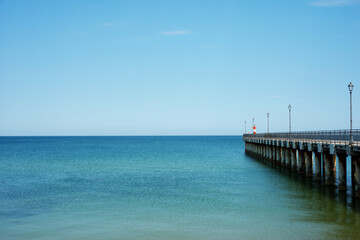 Fototapeta na wymiar Calm blue sea and pier