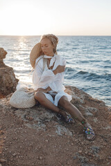Portrait of a happy young woman with hat and bag outdoors
