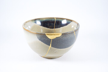 Beige kintsugi bowl with gold scars