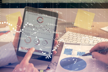 Multi exposure of man's hands holding and using a digital device and data theme drawing. Innovation concept.