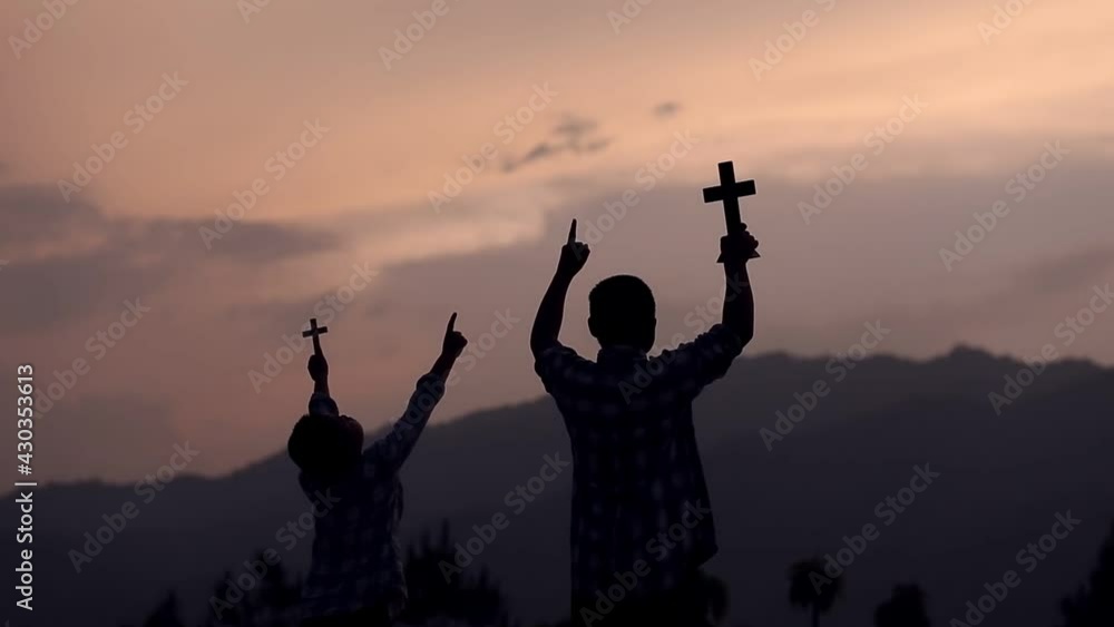 Wall mural Two young christian worship with Cross on the hill, Christian silhouette concept. - Wall murals