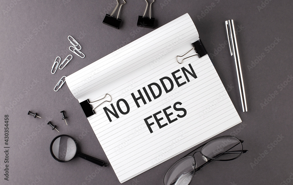 Poster text no hidden fees on notebook and office tools on the gray desktop
